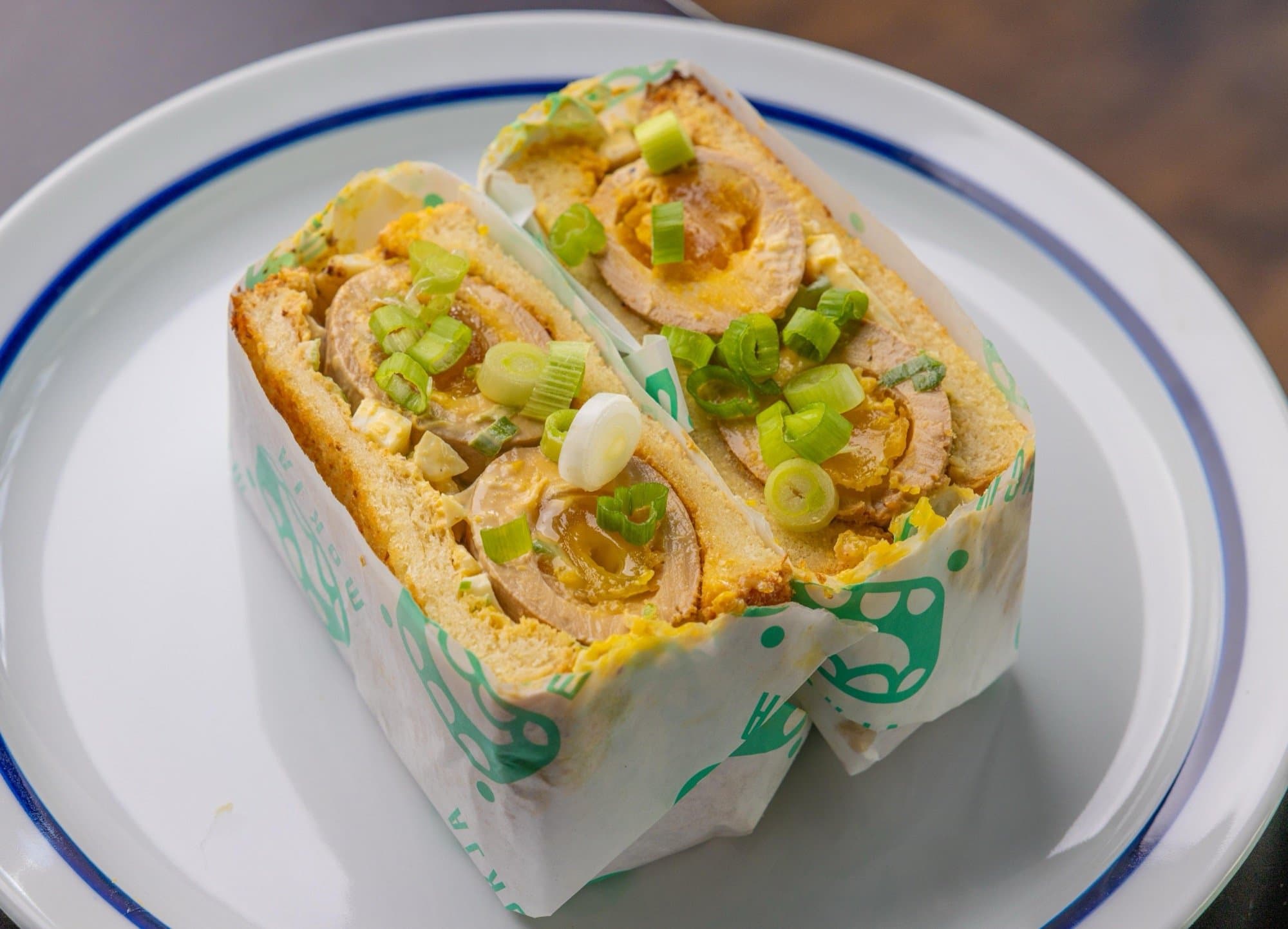 Mayak egg salad sandwich on thick milk bread with scallions and sesame